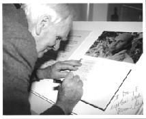 Desmond Llewelyn signs the visitors book